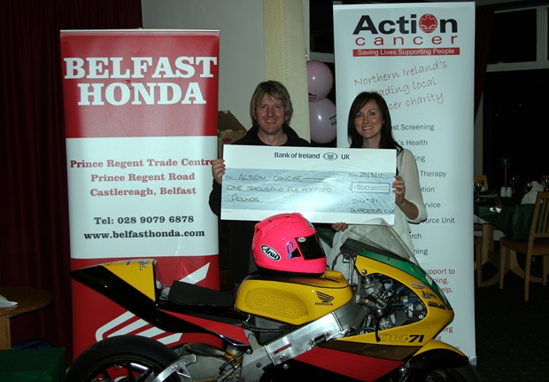 Davy Morgan presents a cheque for £1500 to Kerry Anderson of Action Cancer